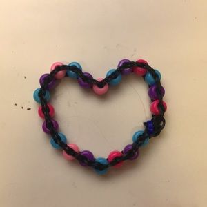 I am selling hey beaded rainbow loom bracelet that is pink purple and blue